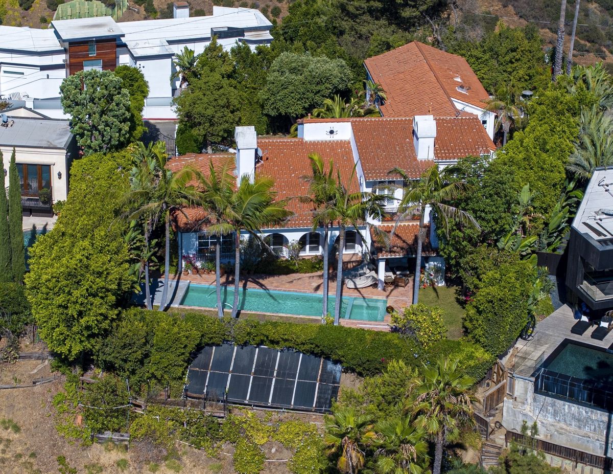 The estate sprawls across nearly 5,000 square feet with four spacious bedrooms and five bathrooms.
