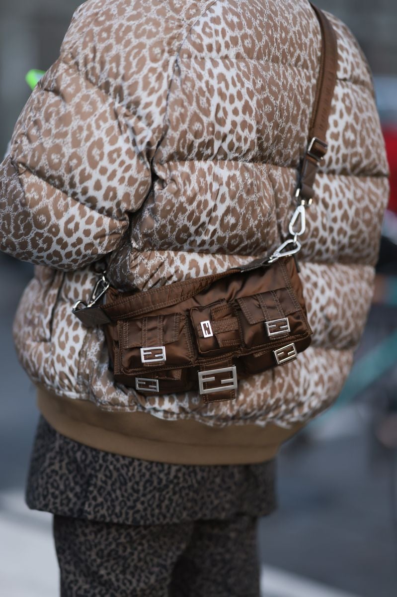 Fashion Week Guest is seen wearing a animal printed puffer jacket, Fendi brown baguette bag, animal printed shirt and pants during the Amiri Menswear Fall/Winter 2024/2025 as part of  Paris Fashion Week on January 18, 2024 in Paris, France. (Photo by Jeremy Moeller/Getty Images)