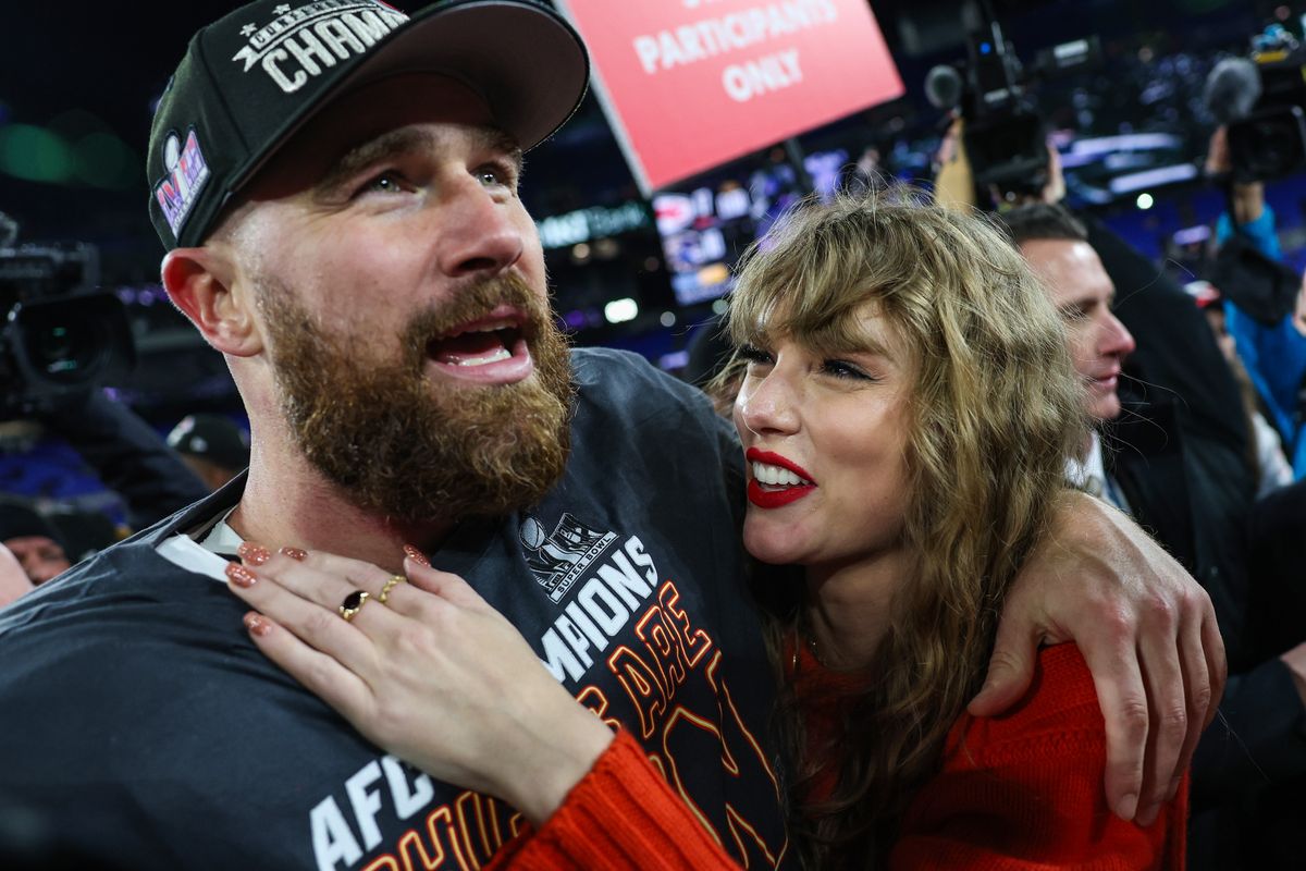 Travis Kelce #87 of the Kansas City Chiefs celebrates with Taylor Swift after defeating the Baltimore Ravens in the AFC Championship Game at M&T Bank Stadium on January 28, 2024