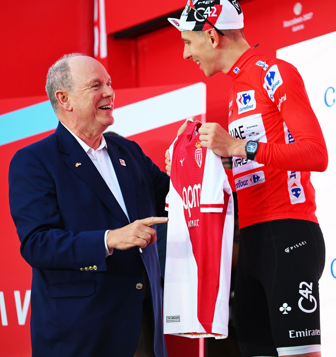 Prince Albert II of Monaco joins Tadej Pogačar on the podium during the historic opening weekend of La Vuelta 2026 in Monaco.