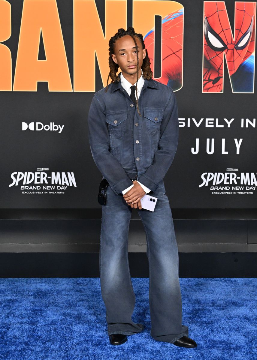 Known for his experimental fashion, Jaden Smith switched things up in a blue denim jacket and matching wide-leg jeans, styled with a crisp white shirt and black tie.