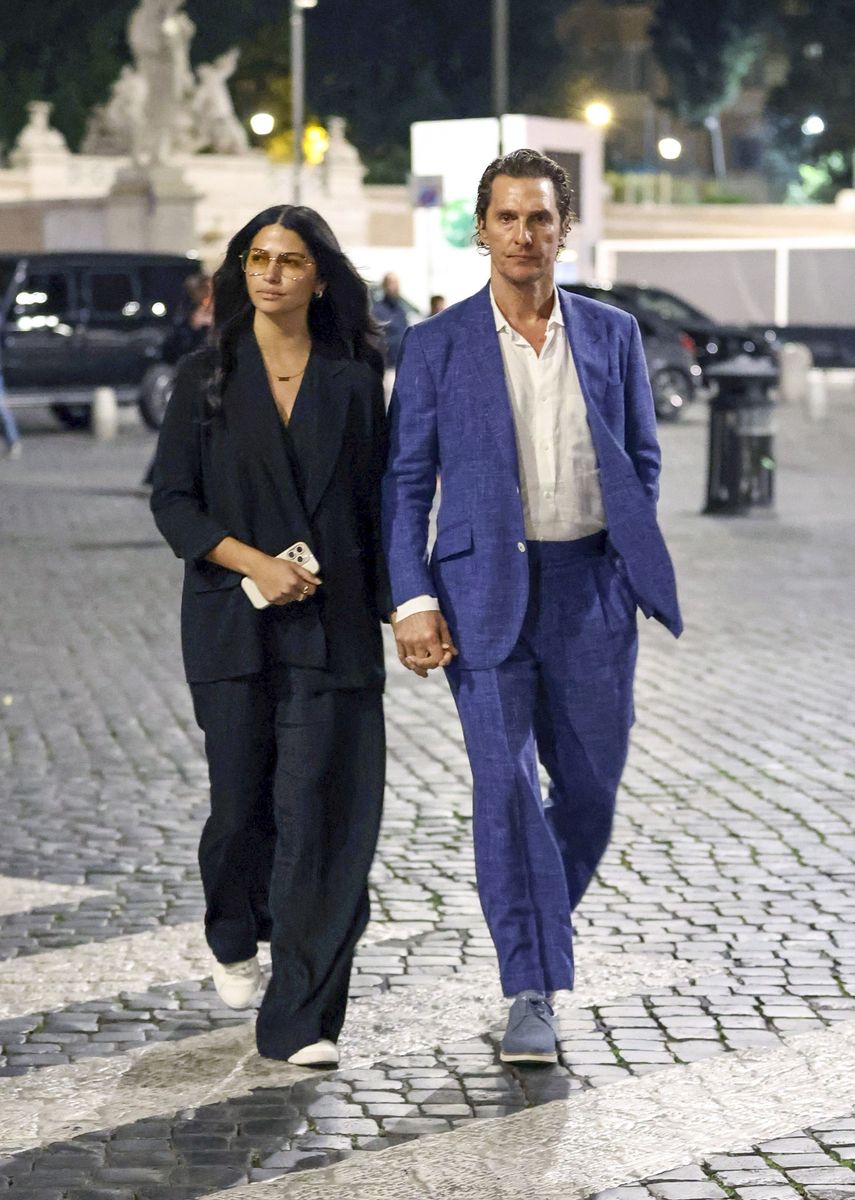 Matthew McConaughey is seen having dinner at a restaurant in Rome with his wife Camila Alves and friends. The couple later take a walk through the city, holding hands as they enjoy the surroundings. 