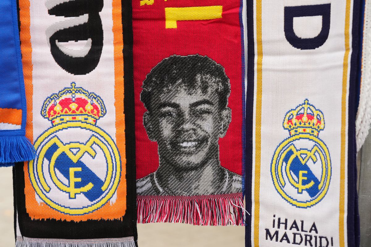 MADRID, SPAIN - OCTOBER 26: A detailed view of a match day scarf, displaying an image of Lamine Yamal of FC Barcelona (not pictured) ahead of the LaLiga match between Real Madrid CF and FC Barcelona at Estadio Santiago Bernabeu on October 26, 2024 in Madrid, Spain. (Photo by Angel Martinez/Getty Images)