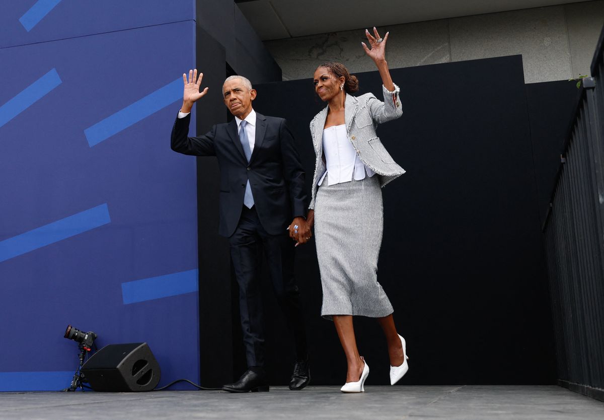 Fomer US president Barack Obama and his wife Michelle Obama arrive at the opening of the Barack Obama Presidential Center in Chicago, Illinois, on June 18, 2026.