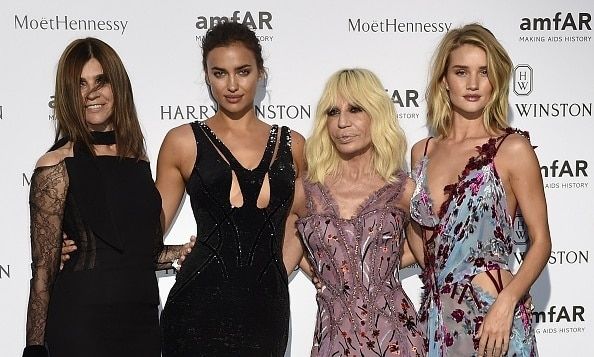 July 5: Rosie Huntington-Whiteley (far right) glammed it up with Donatella Versace, Irina Shayk and Carine Roitfeld at the amfAR dinner in Paris.
Photo: Getty Images