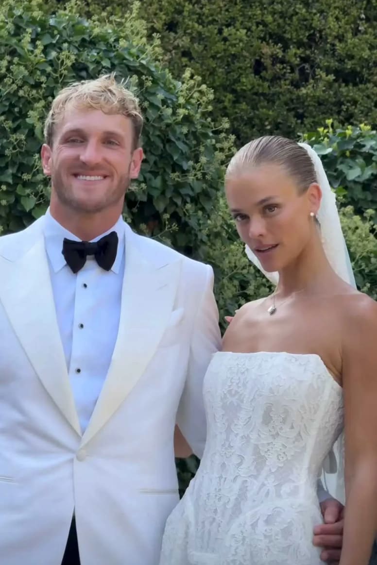 Nina looked radiant in a strapless corseted lace gown with a long flowing veil, while Logan wore a sharp white jacket, black bow tie, and black trousers.