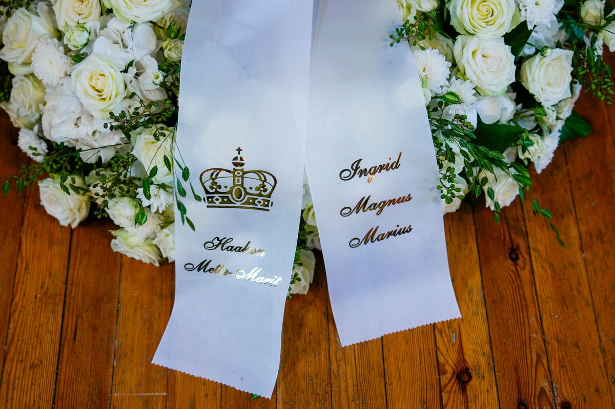 King Haakon and Queen Mette-Marit honored Princess Astrid with a family wreath bearing the names of Ingrid, Magnus and Marius.