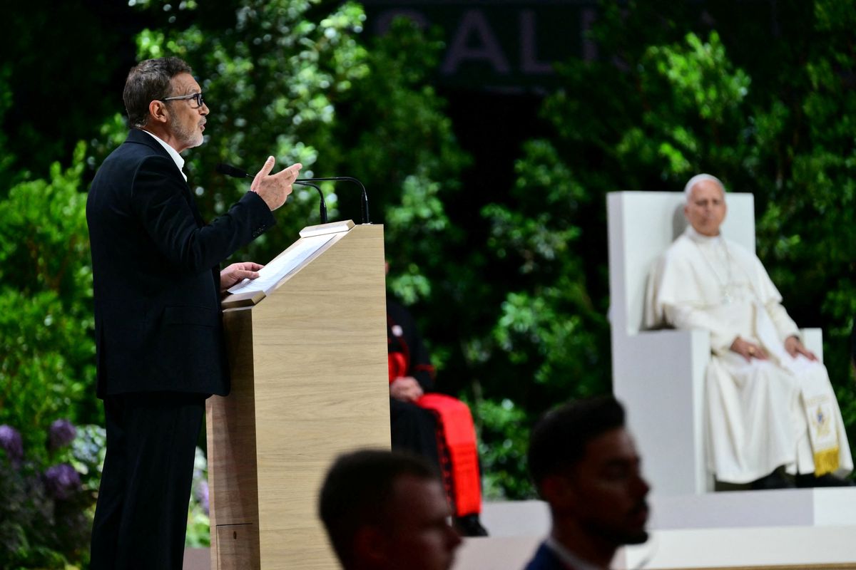 Spanish actor Antonio Banderas speaks on stage next to Pope Leo XIV during the meeting "Building networks with the world of Culture, Art, Economy and Sports" at the Movistar Arena in Madrid on June 7, 2026