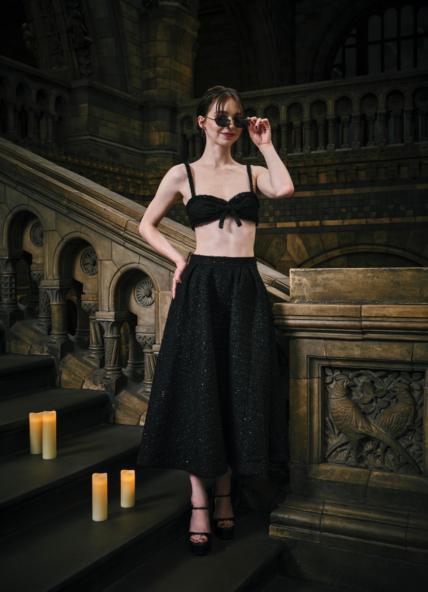 Emma Myers sported a tiny black glittering bralette with a matching midi skirt. 