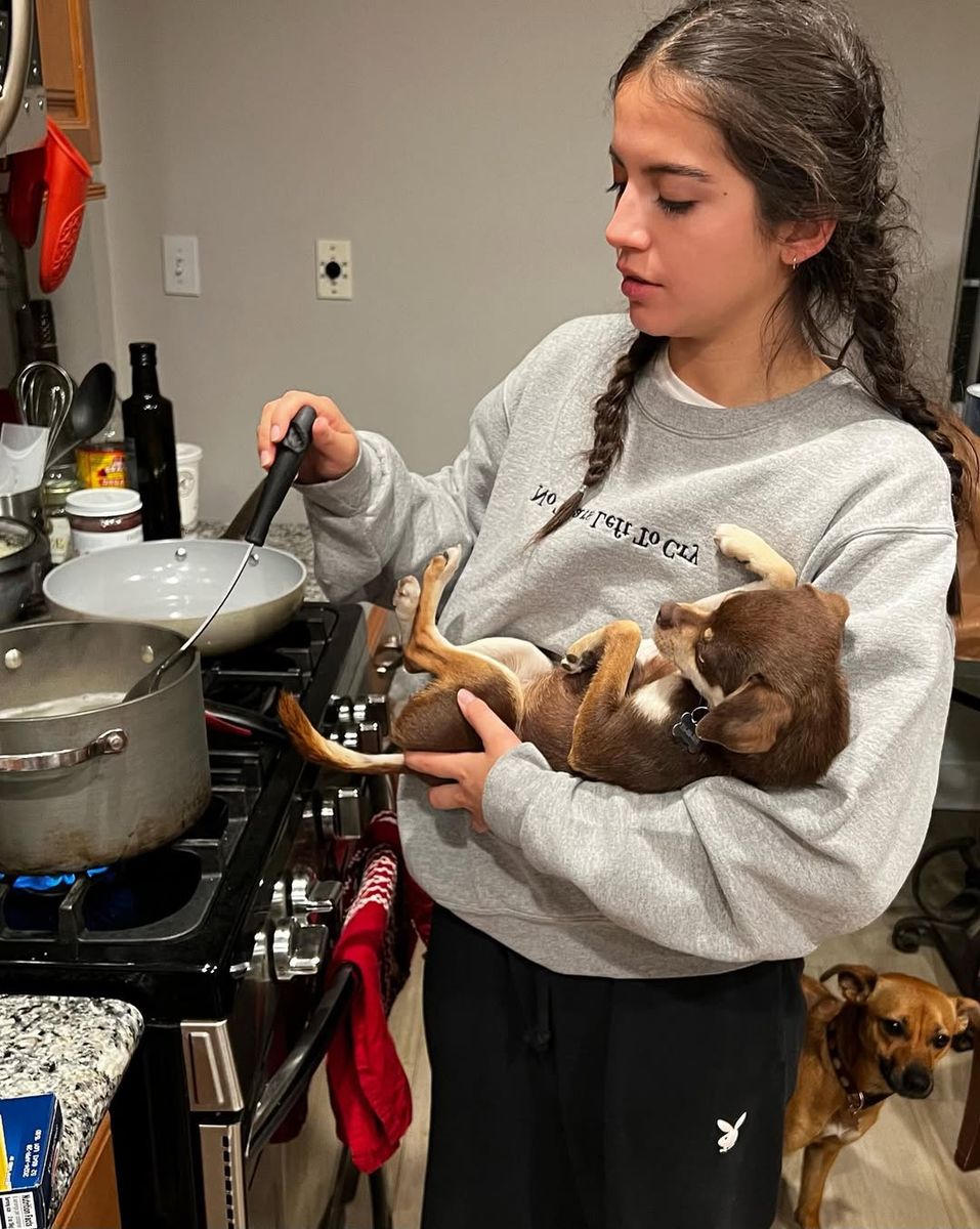 Isabela Merced and her dog Bonbon and Canela