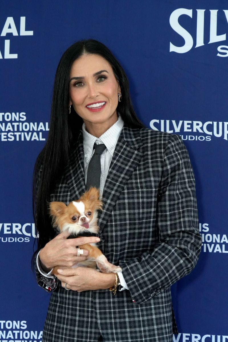 Demi Moore and her dog Pilaf attend the Chairman's Reception at the 2024 Hamptons Film Festival 