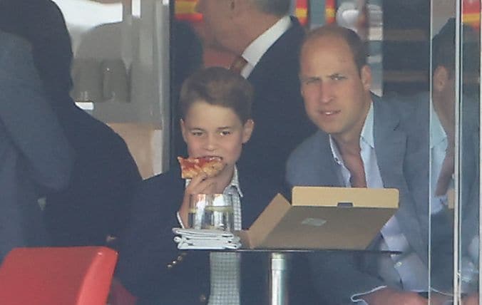 Prince George pictured eating pizza at a cricket match with his father in 2023