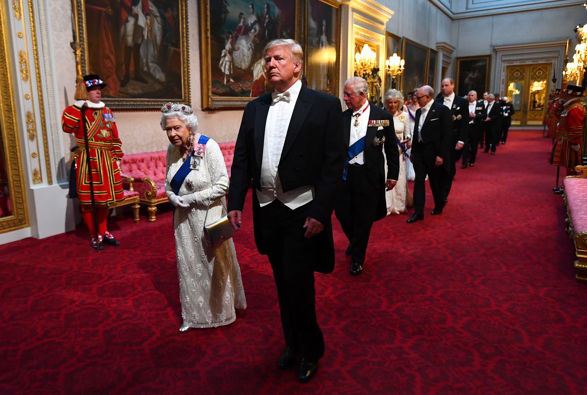 LONDON, ENGLAND - JUNE 03: (L-R) Queen Elizabeth II, U.S. President Donald Trump and Prince Charles, Prince of Wales arrive through the East Gallery for a State Banquet at Buckingham Palace on June 3, 2019 in London, England. President Trump's three-day state visit will include lunch with the Queen, and a State Banquet at Buckingham Palace, as well as business meetings with the Prime Minister and the Duke of York, before travelling to Portsmouth to mark the 75th anniversary of the D-Day landings.  (Photo by Victoria Jones- WPA Pool/Getty Images)