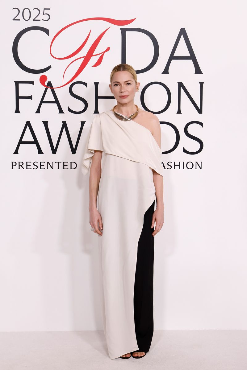 Michelle Williams attends the 2025 CFDA Awards wearing the dress-over-pants trend