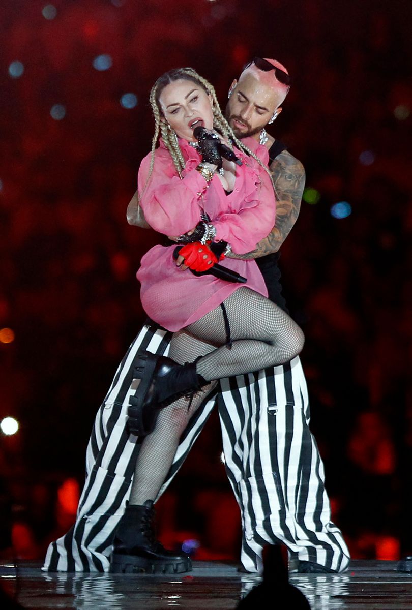 Colombian singer Maluma (back) performs on stage along with pop icon Madonna during his concert "Medallo in the Map", in Medellin, Colombia
