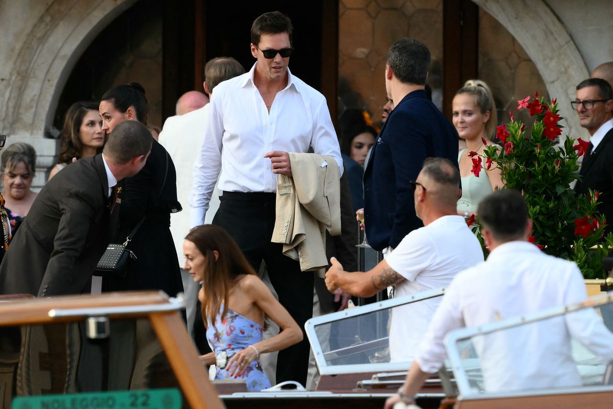 US football player Tom Brady gets on a taxi boat at the Gritti Palace Hotel ahead of the wedding of Amazon's founder Jeff Bezos with Lauren Sanchez in Venice on June 26, 2025. 
