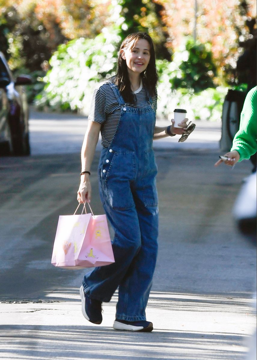Jennifer Garner strikes a youthful pose as she steps out for coffee in Los Angeles. The 53-year-old American actress, who just celebrated a birthday this week, was pictured out wearing a striped top paired with denim overalls and black trainers.