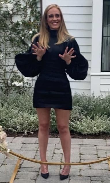 Adele shows off her weight loss in a black mini dress