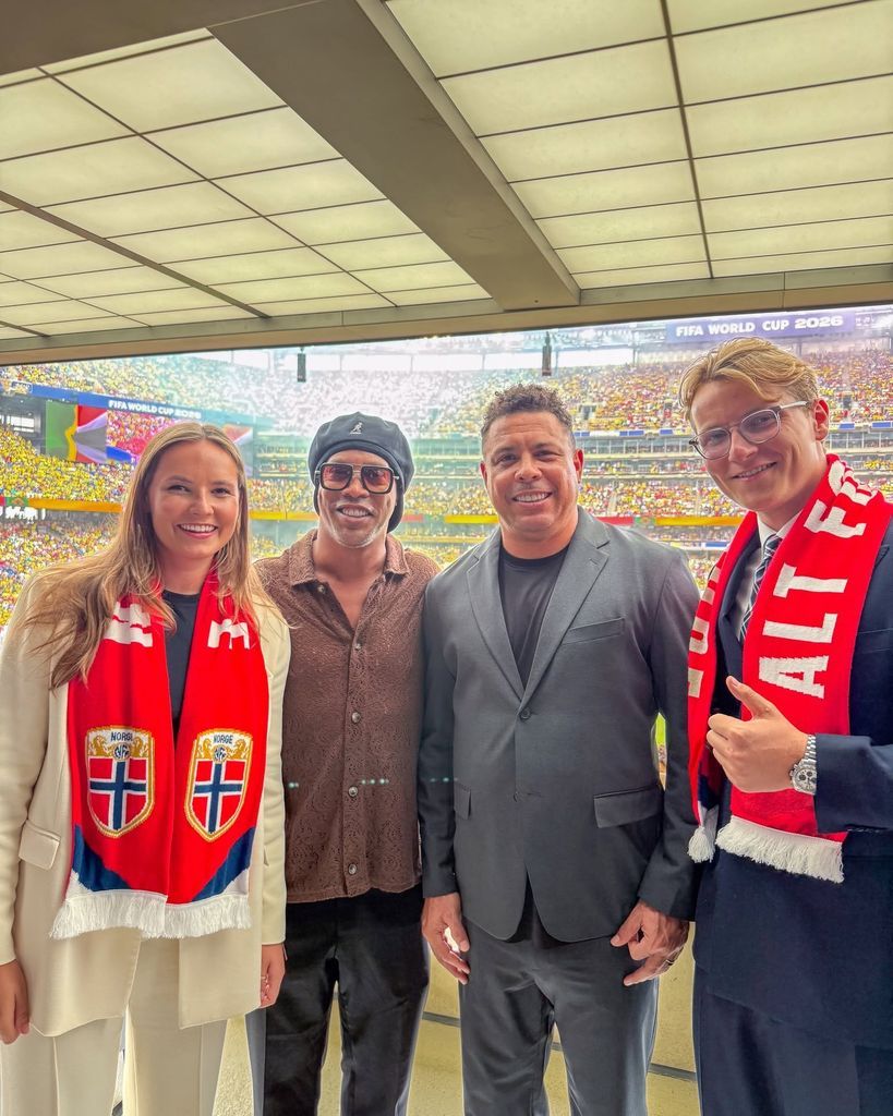 Ingrid and Sverre pose at the stadium alongside former Brazilian footballers Ronaldinho and Ronaldo