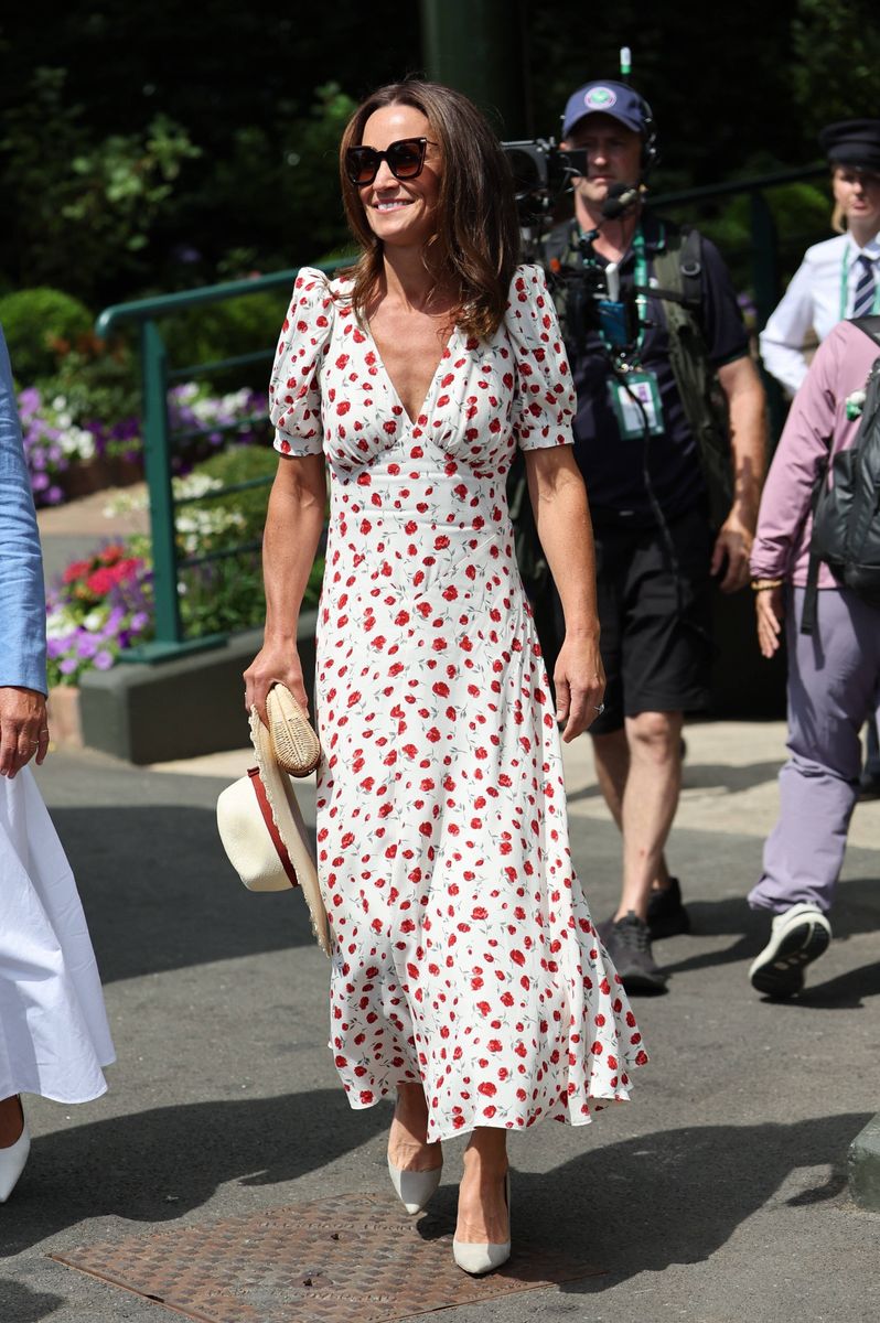 Pippa Middleton returned to Wimbledon in effortless style wearing a romantic floral Reformation dress paired with a cream boater hat and timeless accessories.