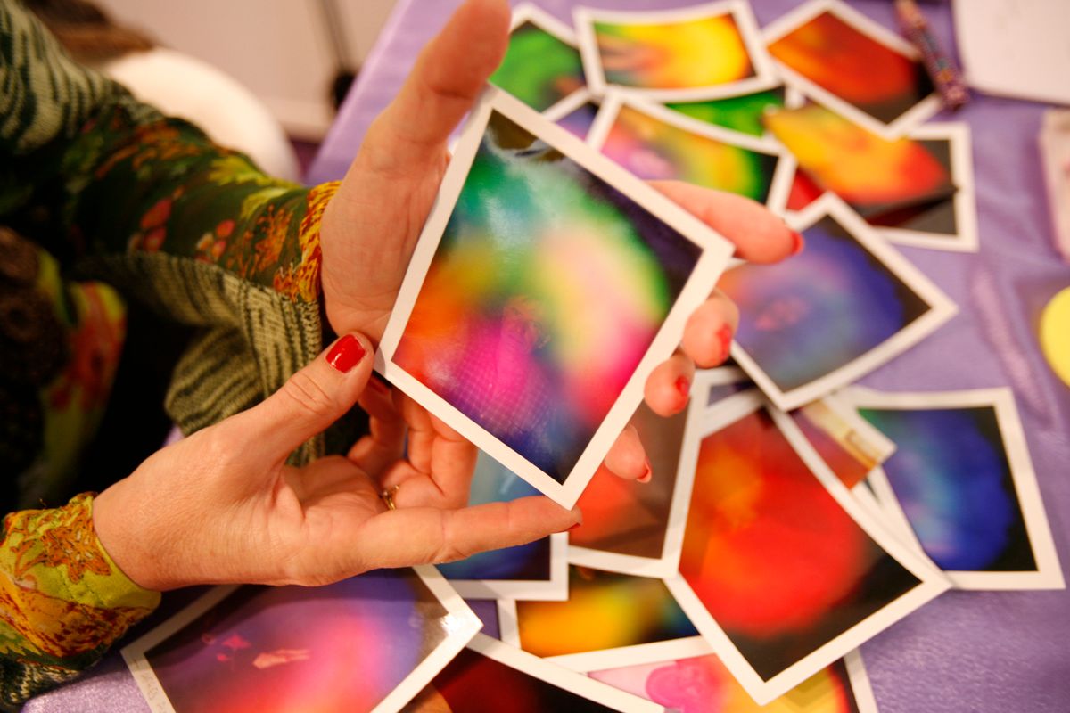 What is aura reading? Four experts explain aura color meanings, how love and stress may affect your energy, and what to know before your first reading.