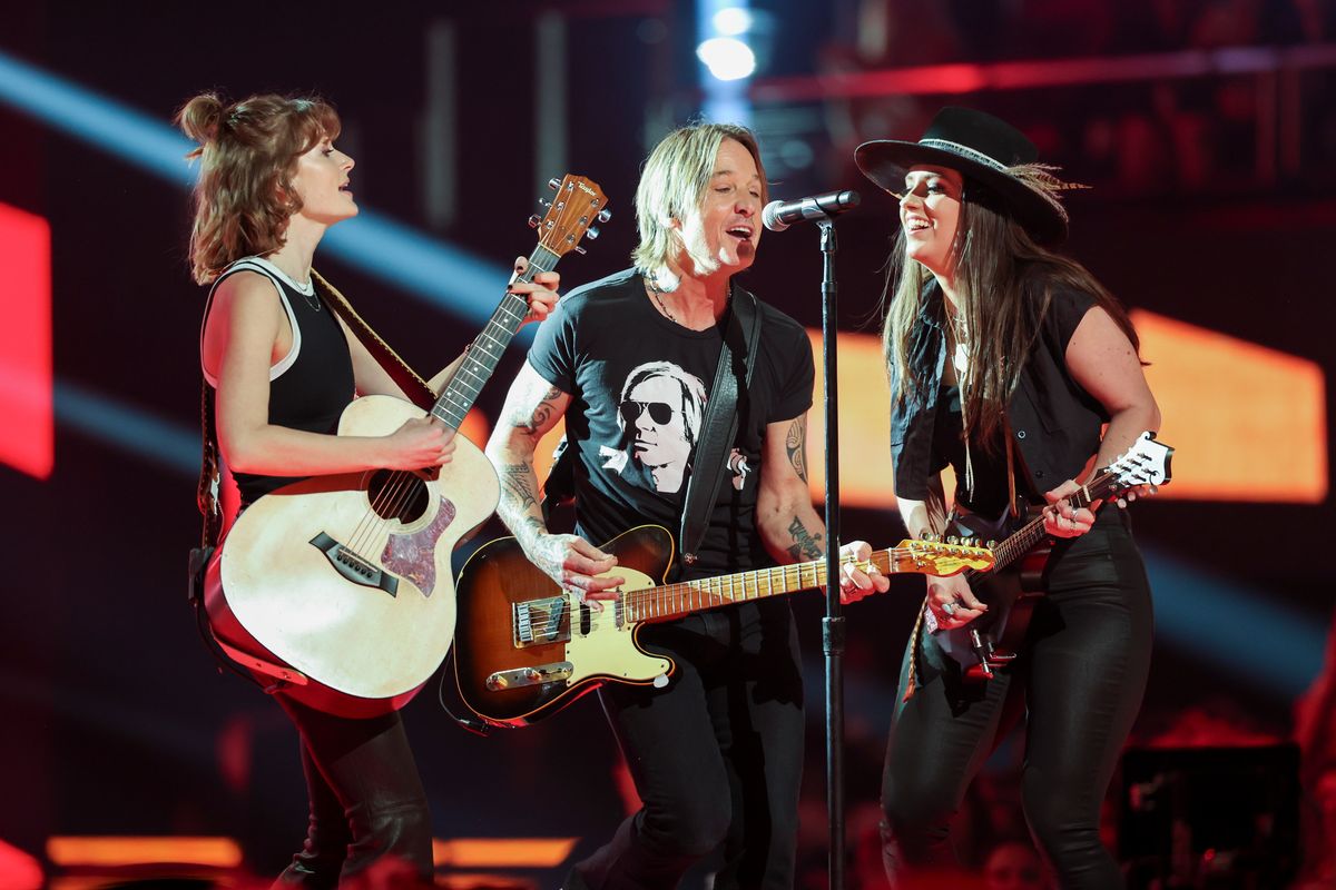 Anna Vaus, Keith Urban and Maggie Baugh perform onstage at the 2024 CMT Music Awards held at the Moody Center on April 7, 2024 in Austin, Texas. 
