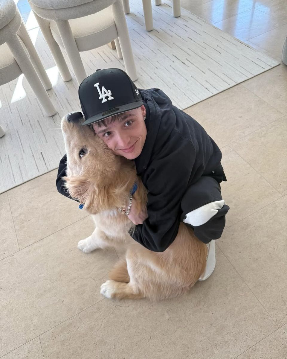 Peso poses with the dog he got with his ex Hanna