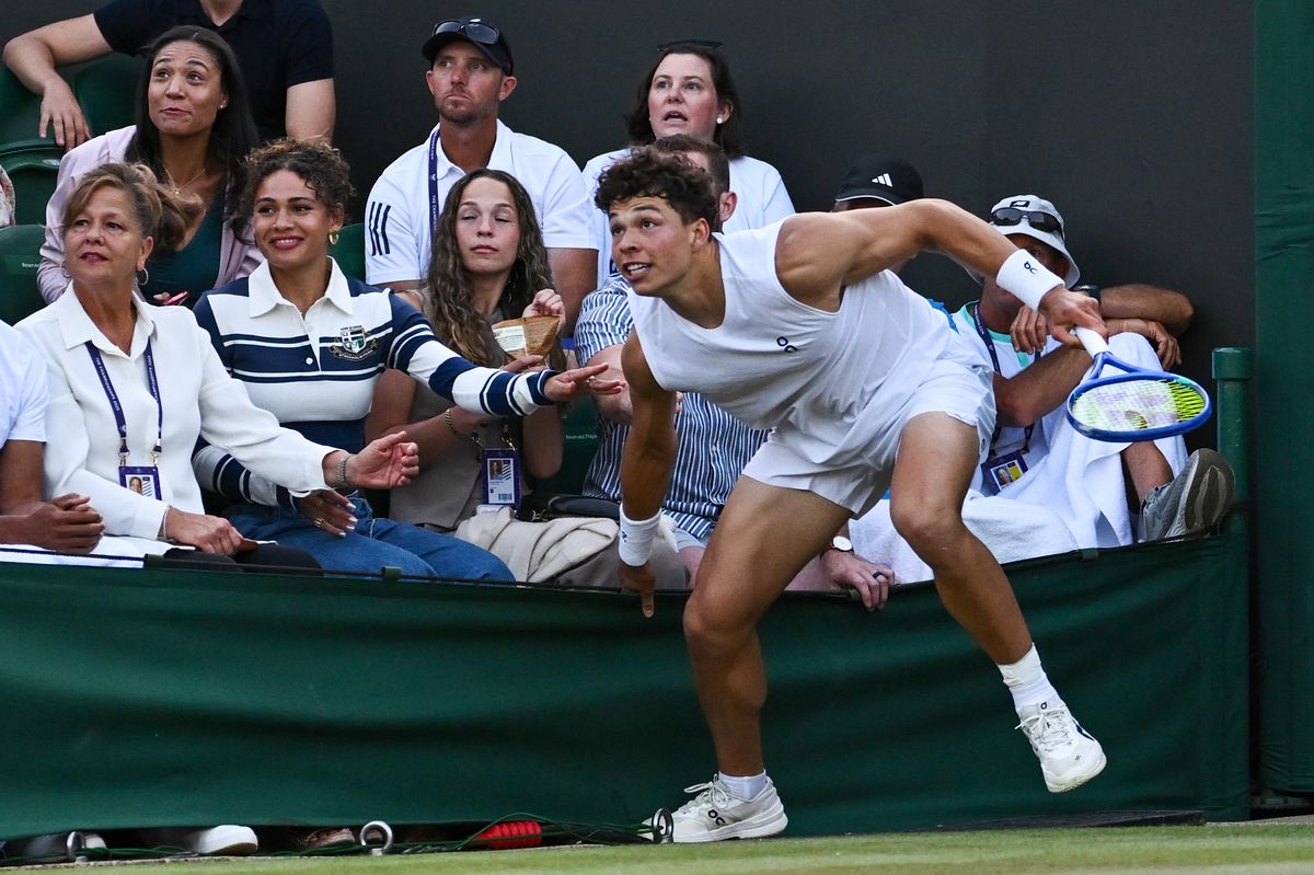 Ben Shelton crashes into his family against Rinky Hijikata of Australia during the Gentlemen's Singles second round match on day four of The Championships Wimbledon 2025