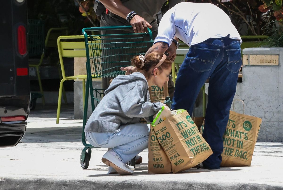 He helped her load the groceries into a waiting vehicle