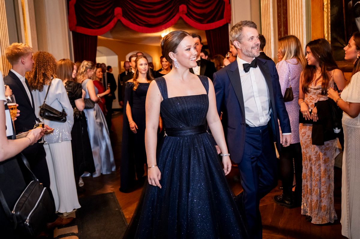Princess Isabella of Denmark (CL) walks with her father King Frederik X of Denmark (CR) at the Royal Theatre's Old Stage as part of celebrations to mark Princess Isabella of Denmark's 18th birthday, in Copenhagen on April 15, 2025. Princess Isabella of Denmark's 18th birthday is on Monday, April 21. (Photo by Ida Marie Odgaard / Ritzau Scanpix / AFP) / Denmark OUT