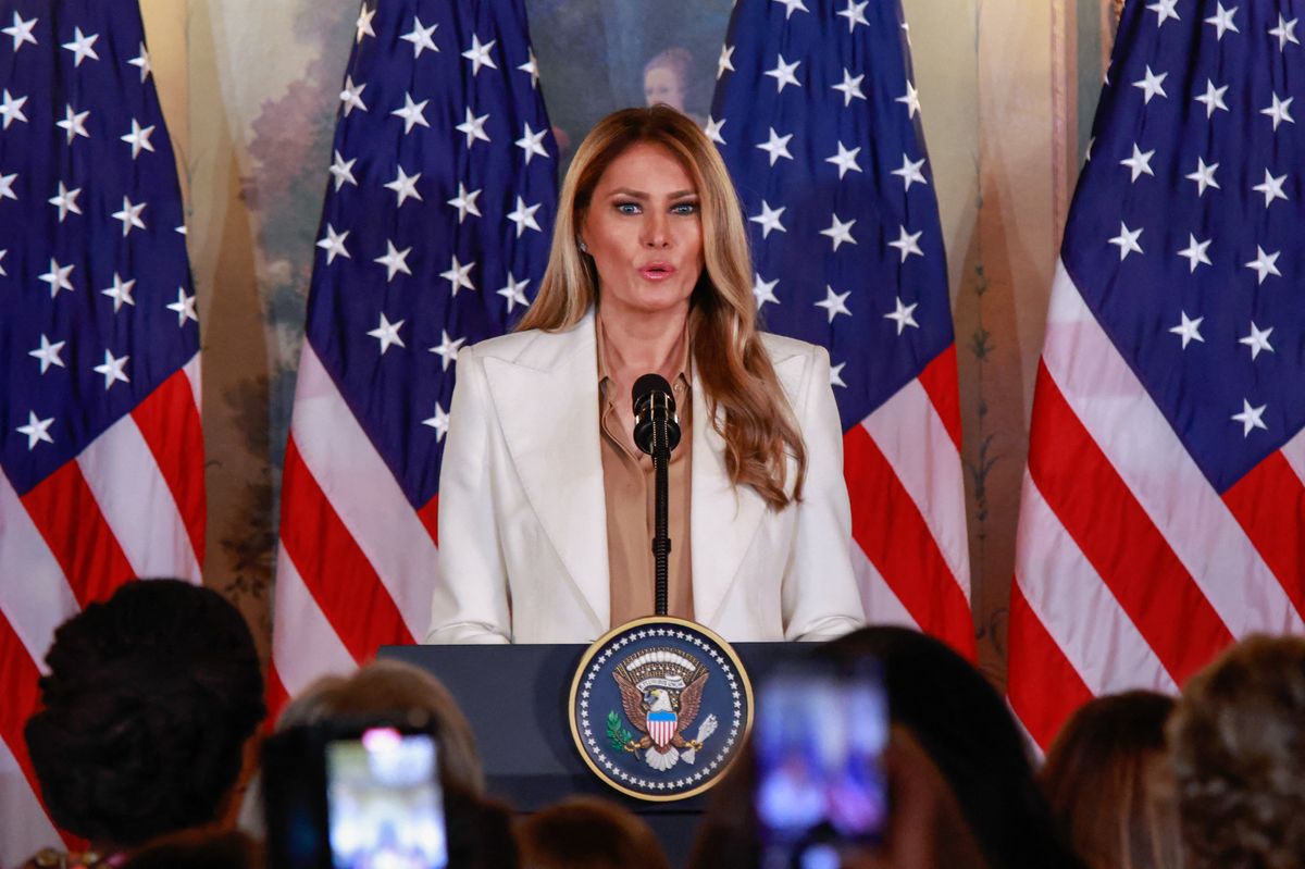Melania Trump steps out in a crisp white Dolce & Gabbana suit paired with a copper Max Mara blouse at the U.N. General Assembly.