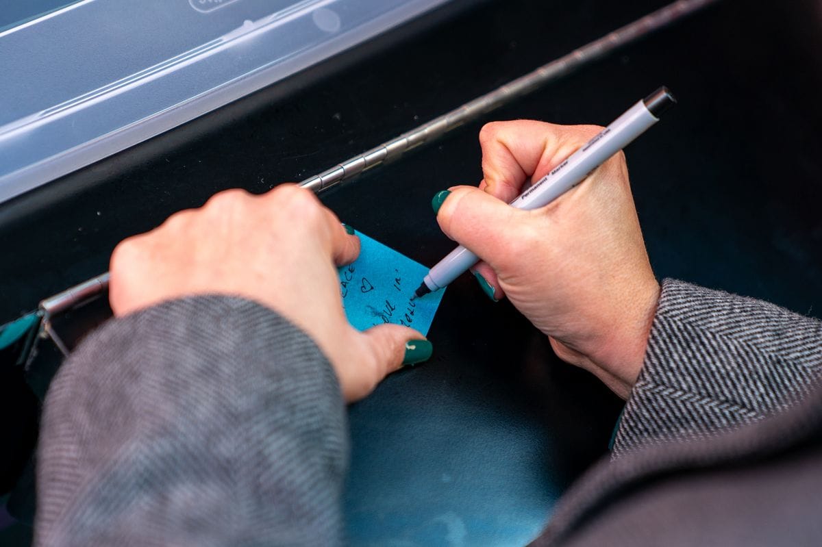  Visitors write down wishes at the New Year's Eve Wishing Wall in Times Square.