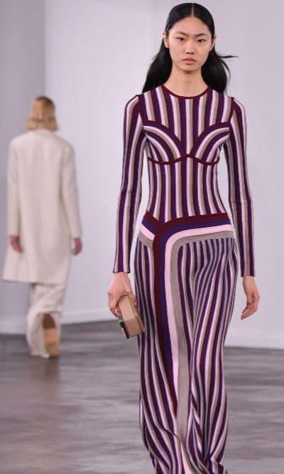 Model wearing a striped dress from Gabriela Hearst collection