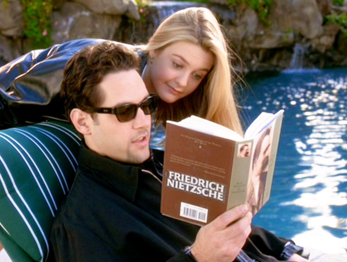 Seen here from left, Paul Rudd (as Josh) and Alicia Silverstone (as Cher Horowitz). He reads Friedrich Nietzsche. Theatrical wide release, Friday, July 21, 1995. Screen capture. Paramount Pictures. (Photo by CBS via Getty Images)