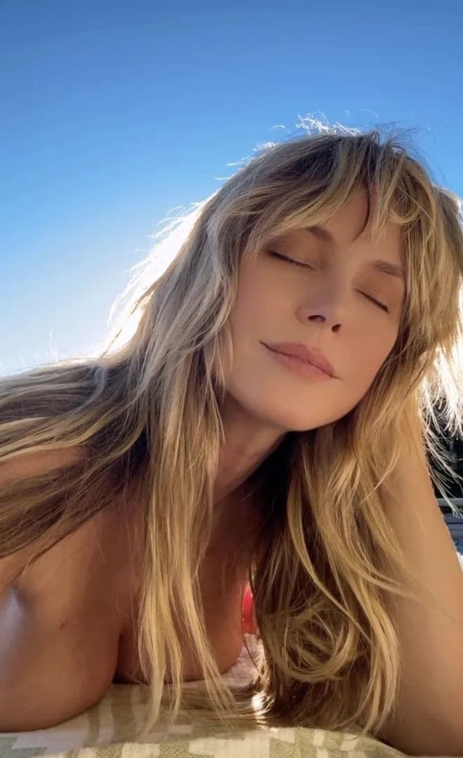 Heidi Klum goes topless in Instagram video as she keeps summer alive