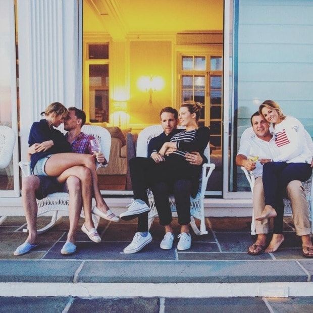Tom and Taylor (left) snuggled in a photo with Blake Lively and Reynolds from the pop star's Fourth of July weekend celebration.
<br>
Photo: Instagram/@britmaack