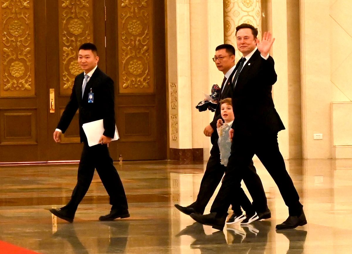 Musk was seen greeting photographers in China