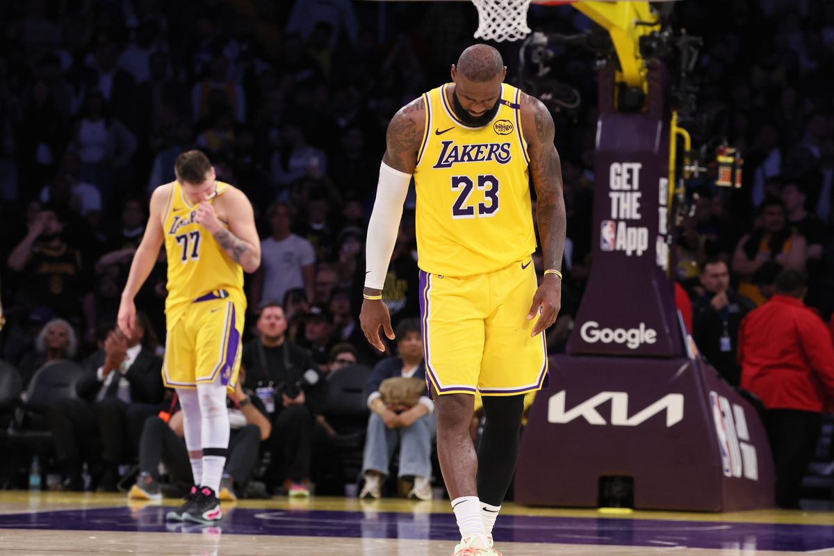 LeBron James (23) and Luka Doncic (77) absorb the inevitable loss to the Minnesota Timberwolves in game 5 of the first round of the NBA playoffs 