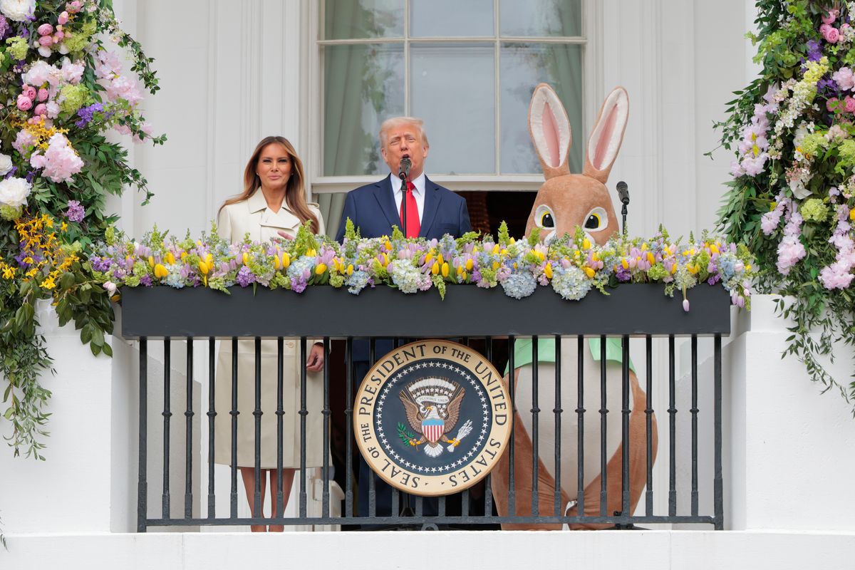 WASHINGTON, DC - APRIL 21: U.S. President Donald Trump, joined by first lady Melania Trump and the Easter Bunny, delivers remarks during the White House Egg Roll on the South Lawn of the White House on April 21, 2025 in Washington, DC. The White House is expecting thousands of children and adults to participate in the annual tradition of rolling colored eggs down the White House lawn, which was started by President Rutherford B. Hayes in 1878. (Photo by Anna Moneymaker/Getty Images)