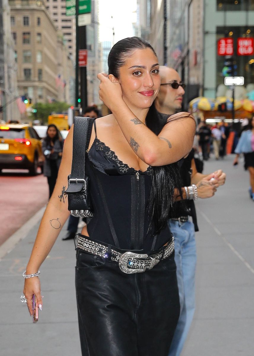 The singer and model paired her lingerie-inspired top with low-slung leather pants, a statement Western belt and pointed black heels.