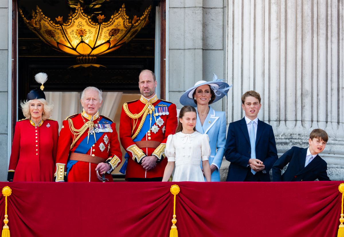 Queen Camilla, King Charles III, Prince William, Prince of Wales, Princess Charlotte of Wales, Catherine, Princess of Wales, Prince George of Wales and Prince Louis of Wales watch an RAF flypast from the balcony of Buckingham Palace
