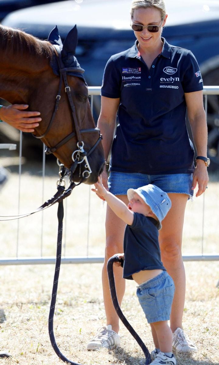 The Queen's great-grandson pet the horse, while his mom Zara looked on.