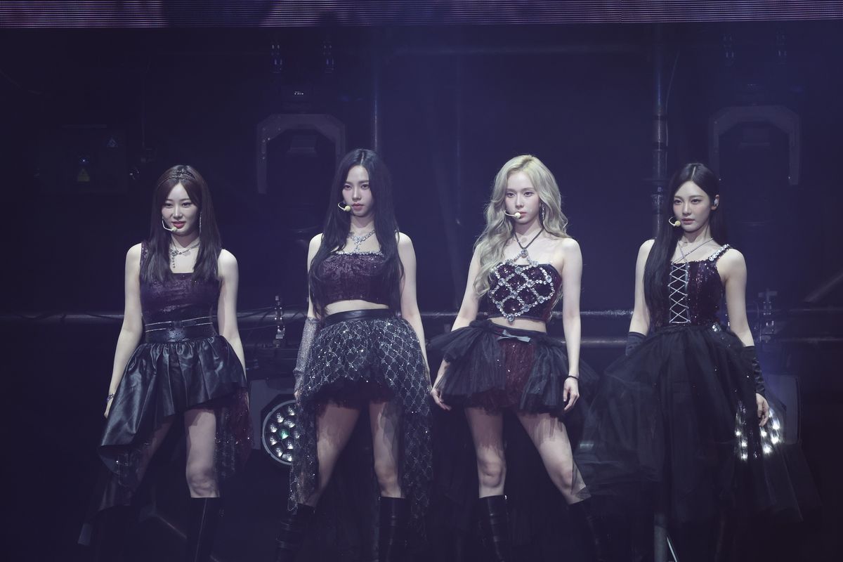 Members of South Korean girl group aespa perform on the stage