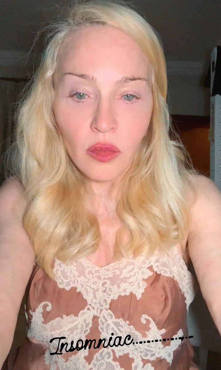 Madonna donned a brown silk slip dress trimmed with sheer cream lace. 