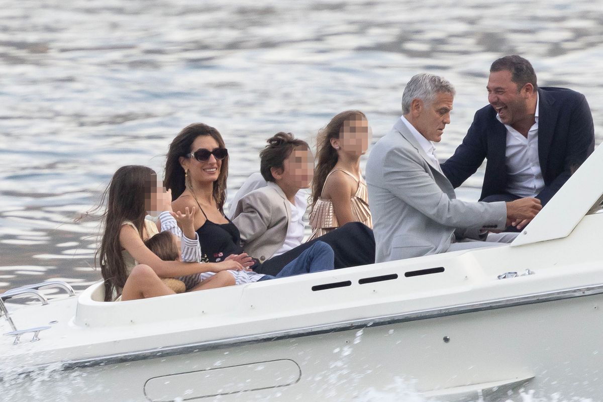 George and Amal Clooney arrived by boat with twins Ella and Alexander for the Clooney Foundation for Justice fundraiser on Italy's Lake Como.