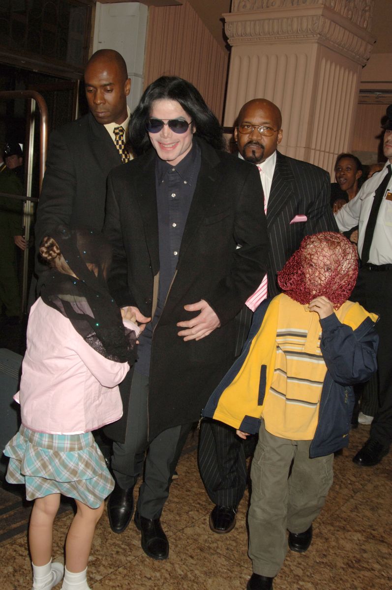Singer Michael Jackson (C) walks with his children, Prince and Paris, as they visit Harrods October 12, 2005 in London, England. 