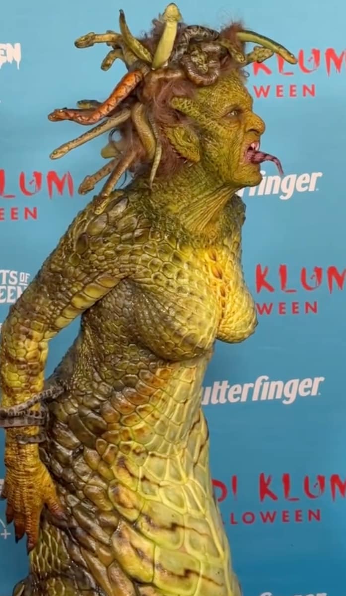 Heidi Klum's eyes were lined in yellow, her teeth sharpened into fangs, and a nest of snakes (crafted with animatronic movement)