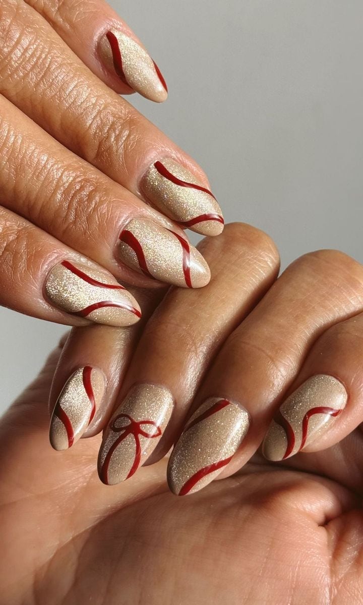 Cat-eye nails with red bow accents
