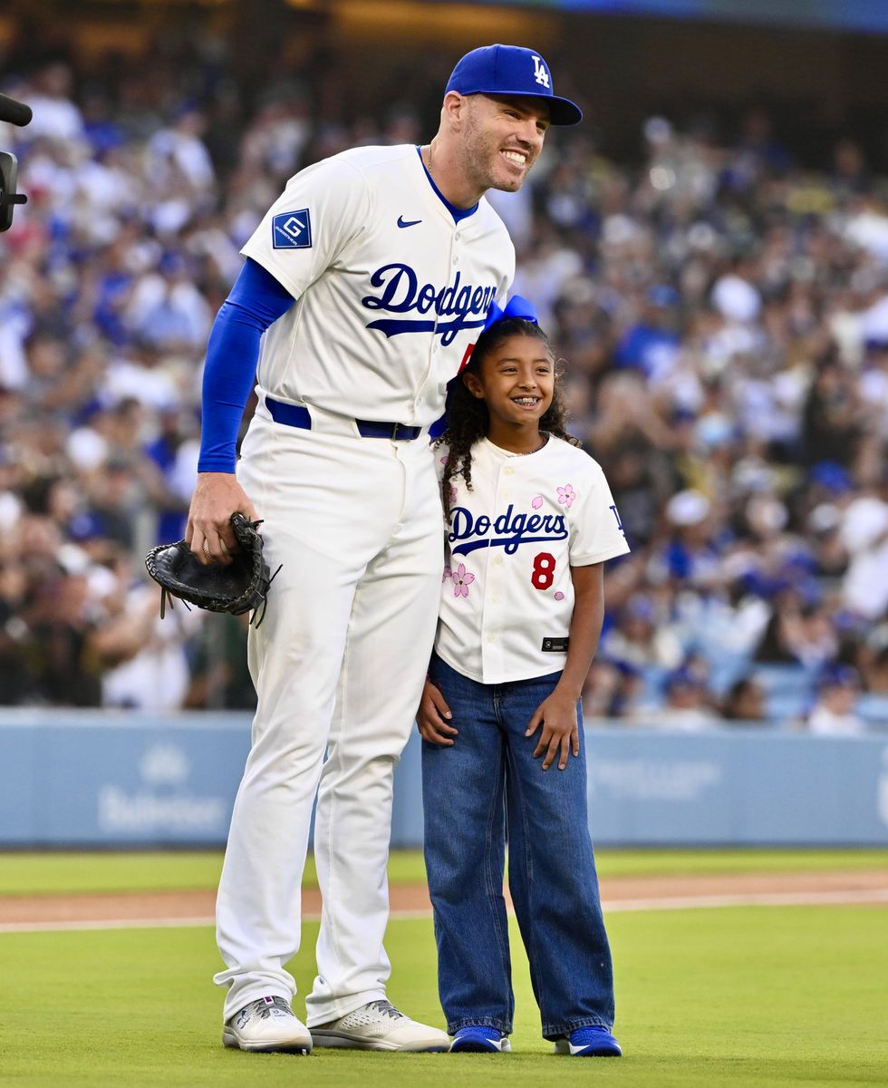 Bianka Bryant with Freddie Freeman after throwing out the ceremonial pitch on 