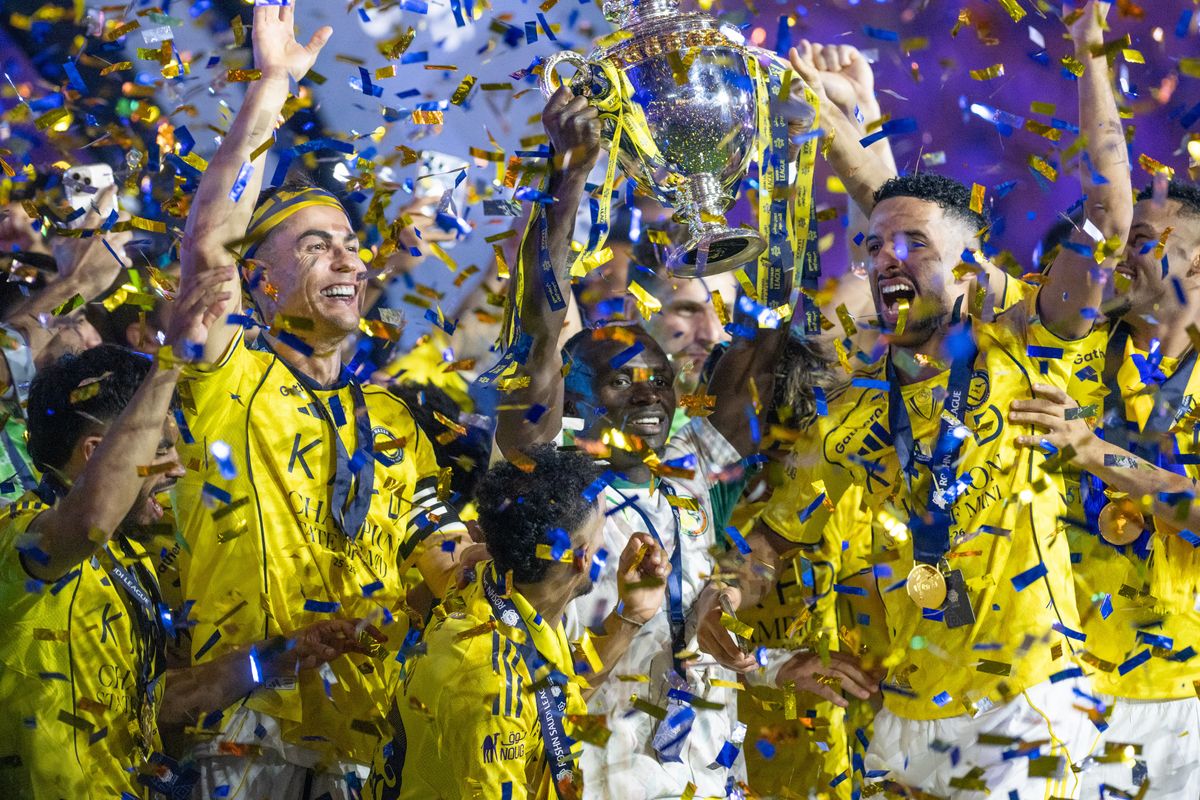 Players of Al-Nassr celebrate the championship with trophy after defeating Damac 4-1 in the Saudi Pro League at King Saud University Stadium in Riyadh, Saudi Arabia, on May 21, 2026